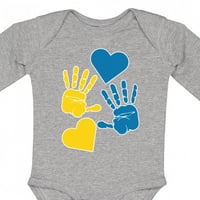 Inktastična dolje Sindromska svijest s otisci ruku i srca plavim i žutim poklonom dječje djeteta ili
