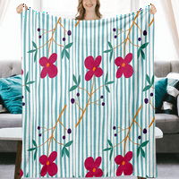 Vintage cvjetni prugasti pokrivač s jastučnicima za kućni kauč krevet i kauč toplog udobnog pozadina